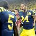 Michigan senior cornerback Troy Woolfolk  celebrates with sophomore cornerback Courtney Avery  after Michigan beat Notre Dame 35-31 during the first-ever night game at Michigan Stadium on Saturday.  Melanie Maxwell I AnnArbor.com